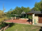 Terrasse mit Saunahaus - Traumhaftes Landhaus in Alleinlage mit Fernblick, Schwimmteich & Saunahaus
